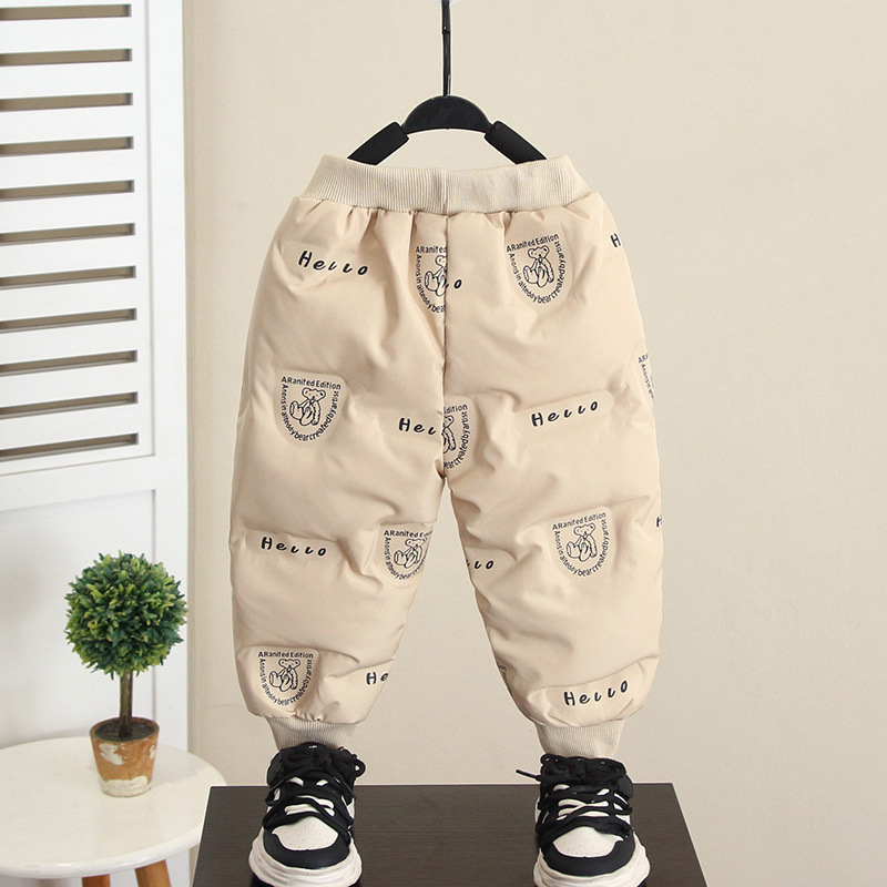 6911 pantalones de plumón de pato blanco para niños 2025 invierno nuevo niño pequeño patito amarillo pantalones gruesos de algodón para bebés marea