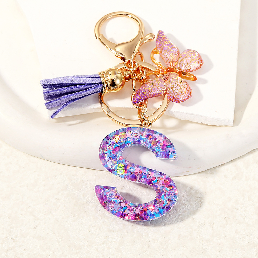Mayorista transfronterizo mariposa esquinilla iniciales llavero de cristal goteo llavero de letras bolsos colgante