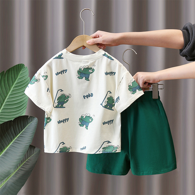 7947 Traje de manga corta para niños 2025 Nuevo verano Camiseta con estampado de dinosaurios de dibujos animados para niños Ropa de moda de verano