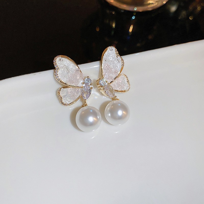 Luz de lujo de alta calidad pendientes de moda pendientes de temperamento fábrica al por mayor Aguja de plata azul cristal flor perla pendientes