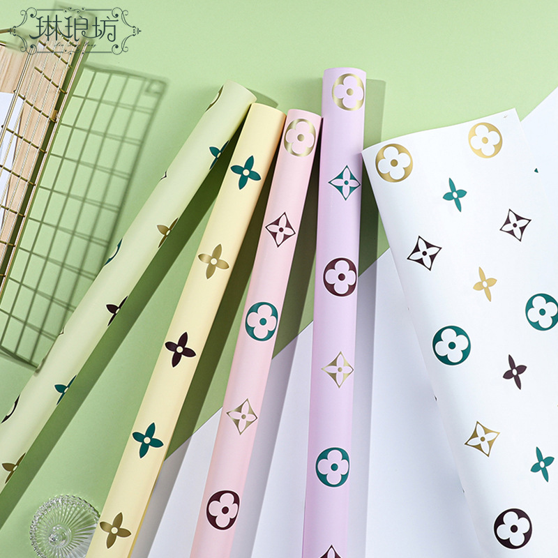 幻彩四叶草防水包装纸大牌图案赫拉纸花艺礼品花束纸高档印刷花纸