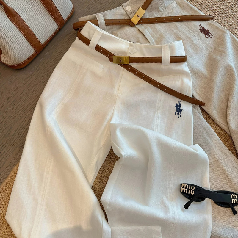 White linen high-waisted wide-leg pants with a small horse embroidery, designed for women, offering a slimming and casual look, a straight-leg style that is currently trending and very popular this summer