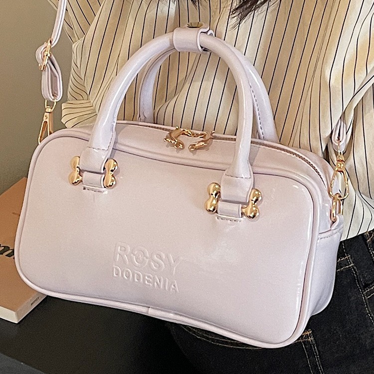 Bolsas de mano de moda populares para mujeres 2026 primavera nuevo estilo coreano sensación diaria bolsas de hombro para trabajar bolsas de viaje