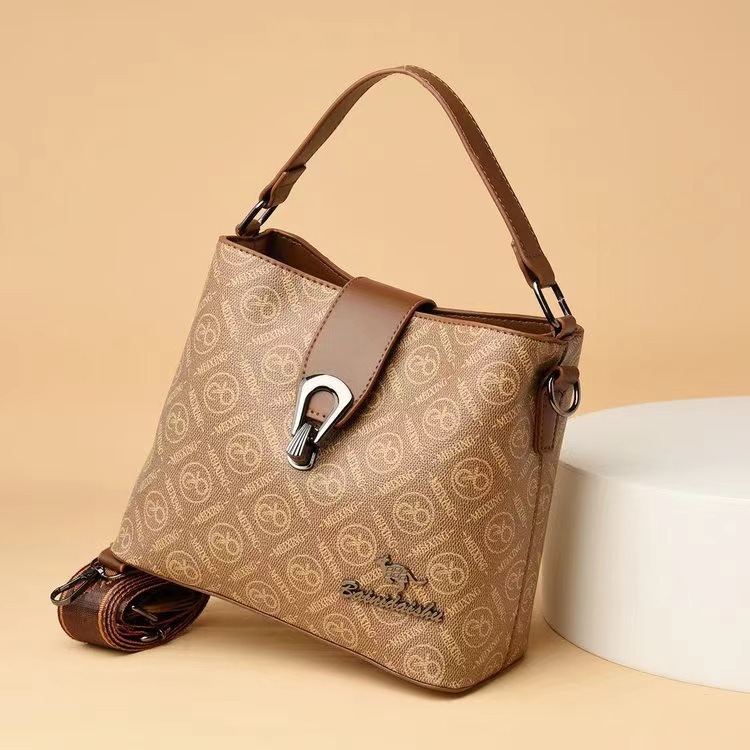 Bolso de cubo de sensación de alta gama para mujer 2025 verano nuevo bolso de hombro clásico de todo fósforo diseño de nicho bolso de mensajero portátil