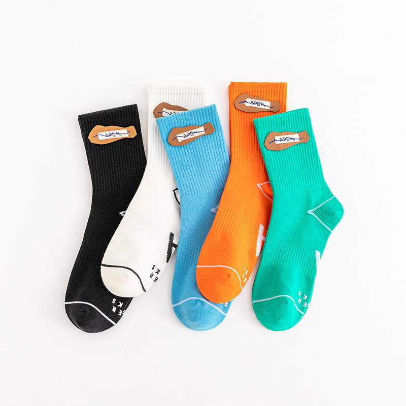 Autumn and winter new reader cowhide label letter sewing socks breathable sports Street tide socks for men and women