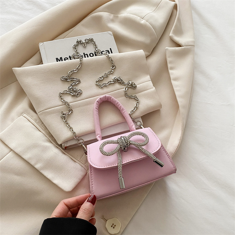 Bowknot Fashion versión coreana de estilo occidental pequeño bolso cuadrado bolso femenino 2025 verano nuevo bolso de cadena de viaje salvaje mujer