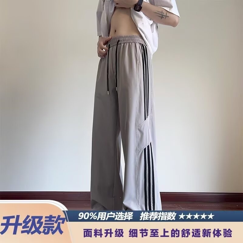 Pantalones casuales a rayas para hombres de primavera y otoño nuevos estudiantes adolescentes sueltos comercio exterior americano tres pantalones para hombres de verano