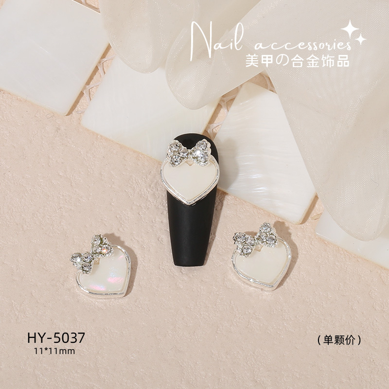 Nuevo arco de uñas amor aleación decoración de uñas flor de la luna mariposa clavo taladro fábrica joyería al por mayor