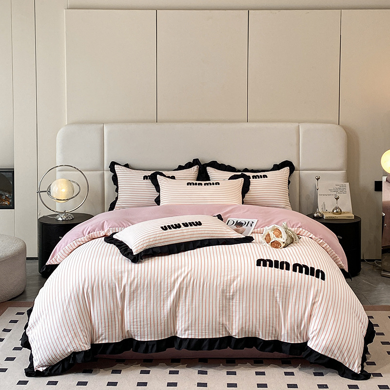 2024 nuevo estilo francés pequeño bordado de toalla de fragancia cuatro piezas funda de edredón sábana simple ropa de cama Nantong al por mayor