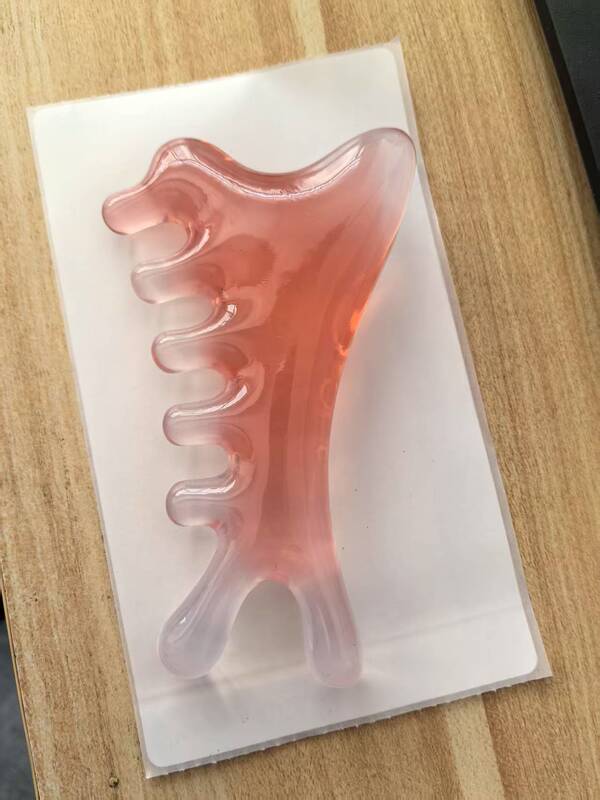 マッサージ櫛の頭の経絡櫛は鼻器の目の顔の経絡樹脂の小さい怪獣を押して櫛をマッサージします。|undefined