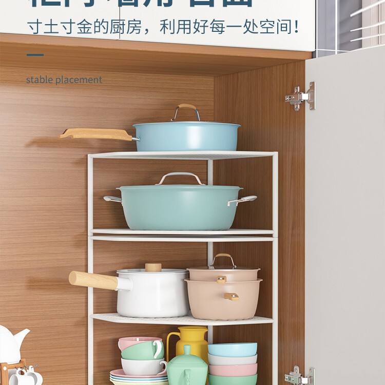 台所の棚のテーブルの角の鍋の収納棚の下の水槽の鍋棚の食器棚の中に鍋の階層棚の神器を入れます。|undefined