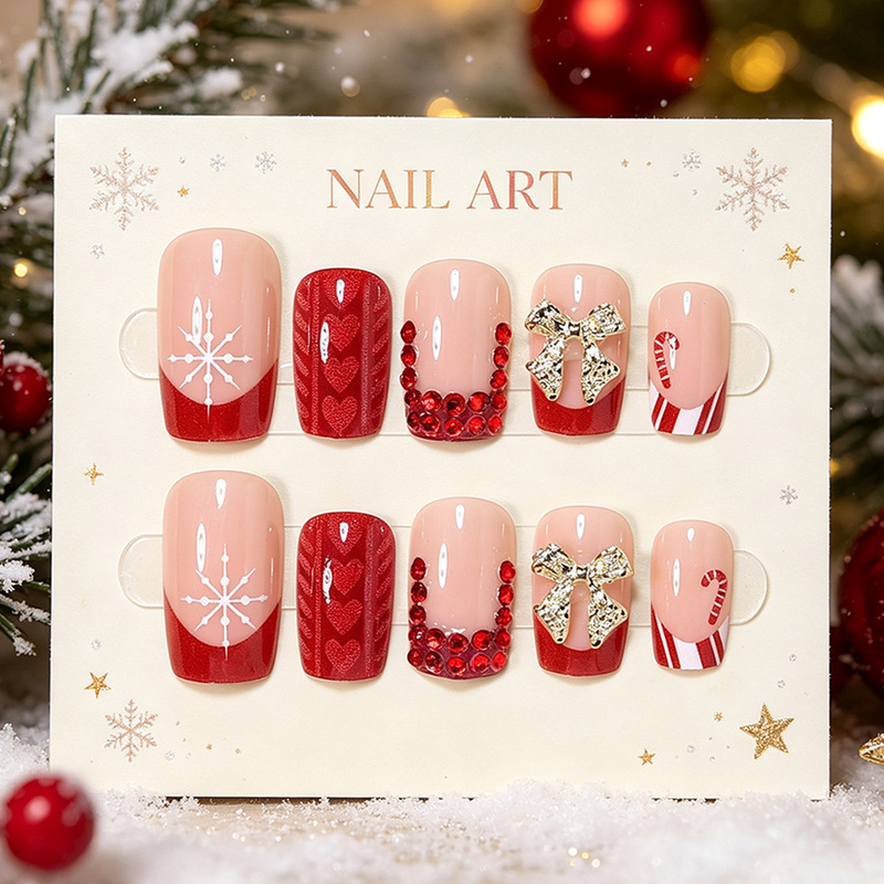24 pieces of cross-border bow-shaped Christmas nail art, featuring snowflake, French-style heart, and 3D gold bow designs, with red rhinestones