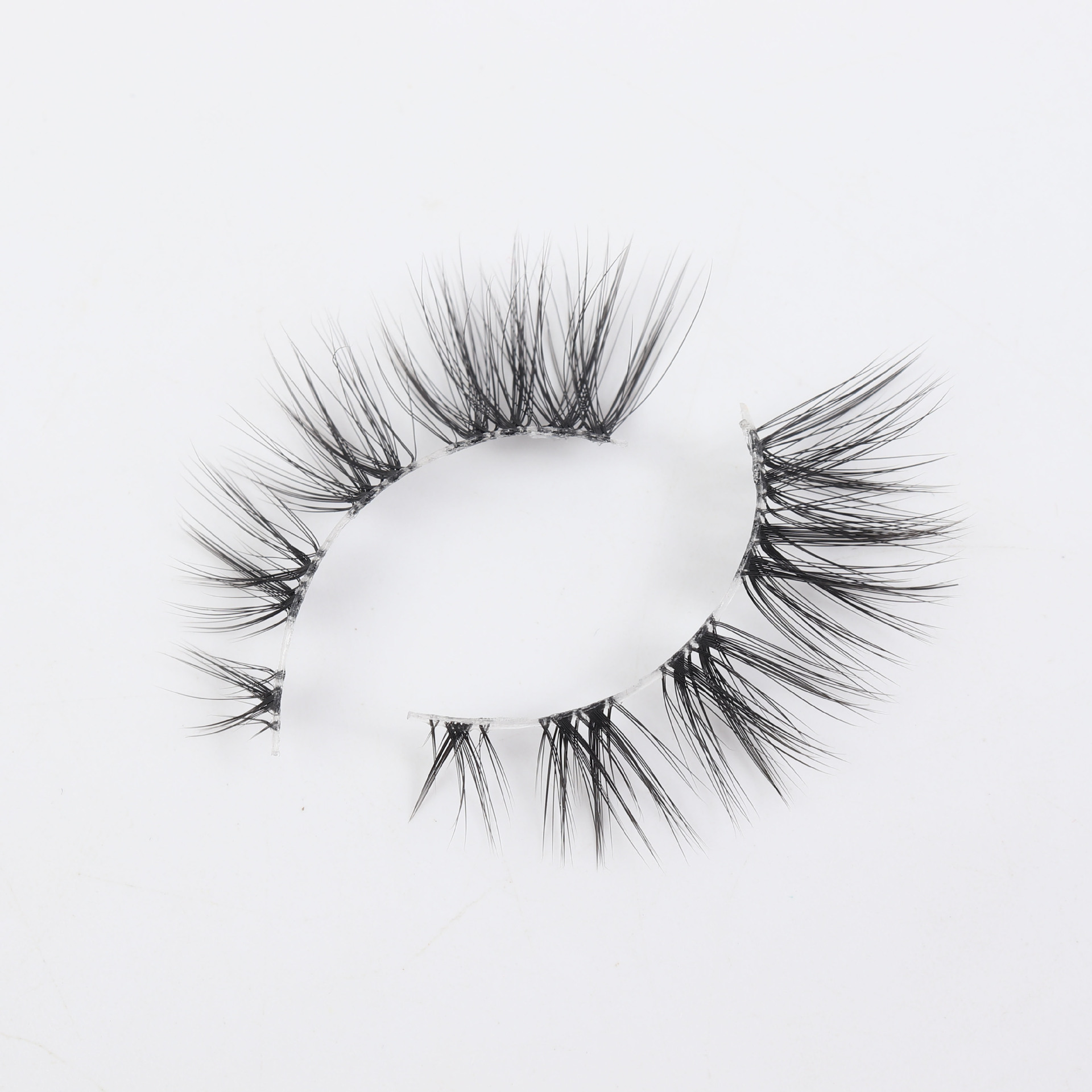 Fabricantes caliente de empuje europeo y americano transfronterizo pestañas postizas Fox serie oblicua de una pieza pestañas de fibra química de tallo transparente