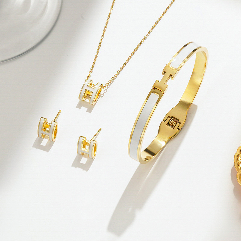 Gold and white necklace earrings bracelet