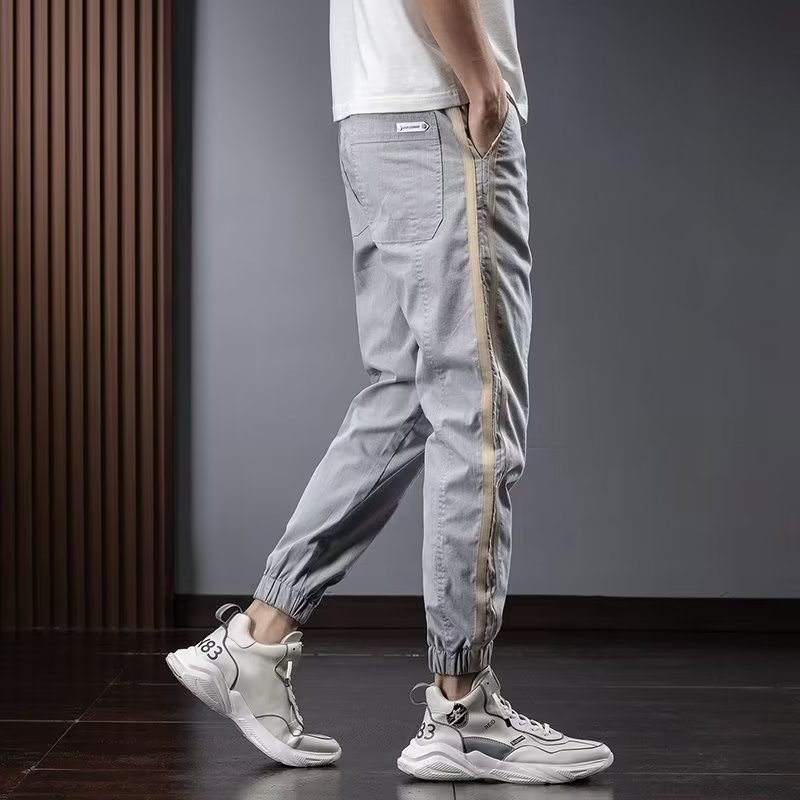Pantalones de herramientas para hombres, modelos de primavera y otoño, moda de marca de moda, otoño delgado, pies sueltos, pantalones vaqueros de talla grande en forma de cono Harlan para hombres