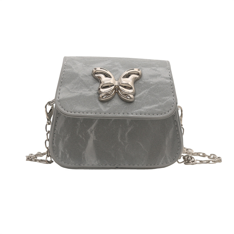 Bolso de fuego para mujeres 2024 nueva cadena bolso de mochila versátil exquisito viento de verano mini bolso plateado