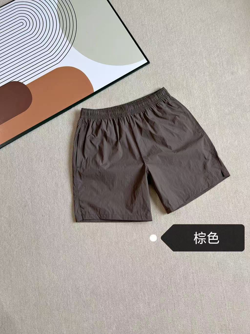 2025 verano nuevo co-marcado para hombres y mujeres transfronterizos pantalones cortos deportivos de tejido 8194