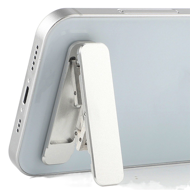 Aleación de aluminio mini soporte de teléfono móvil portátil plegable pequeño marco de soporte cubierta trasera pegatina pasta soporte de teléfono móvil ligero y estable