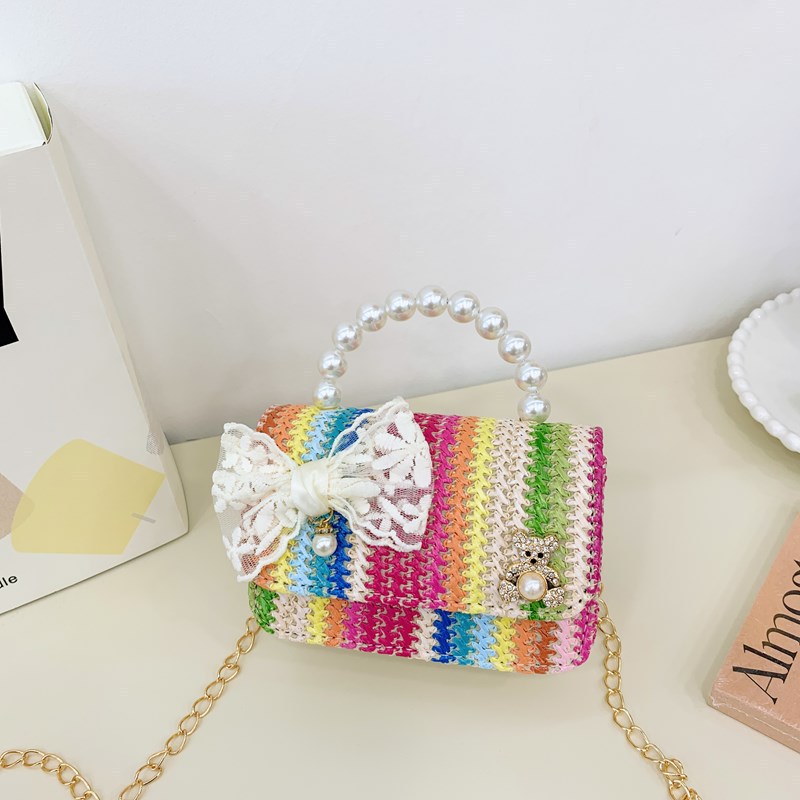 Verano nuevo arco de paja bolso de perla bolso de moda para niños bolso de princesa de jardín de infantes