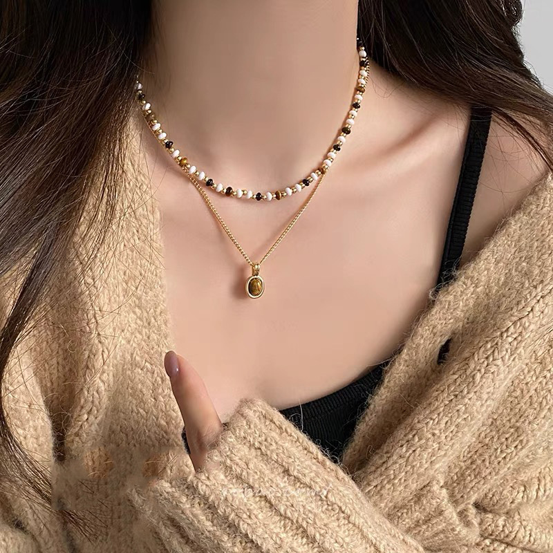 Collar de perlas con lazo de súper hada, cadena de clavícula de moda de lujo ligero francés, sentido de alta gama, joyería de nicho de arte, mujer al por mayor