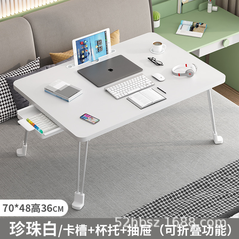 外国貿易輸出大学生寮はベッドの上でノートパソコンのテーブルを畳むことができます。|undefined