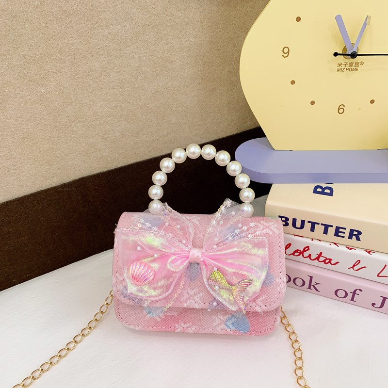 Nuevo bolso para niños niña arco de perla de hombro bolso de mano princesa de estilo extranjero mini bolso de cambio
