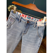 春秋季款斜纹牛仔裤九分裤男高端流行印花浅蓝色弹力修身小脚裤