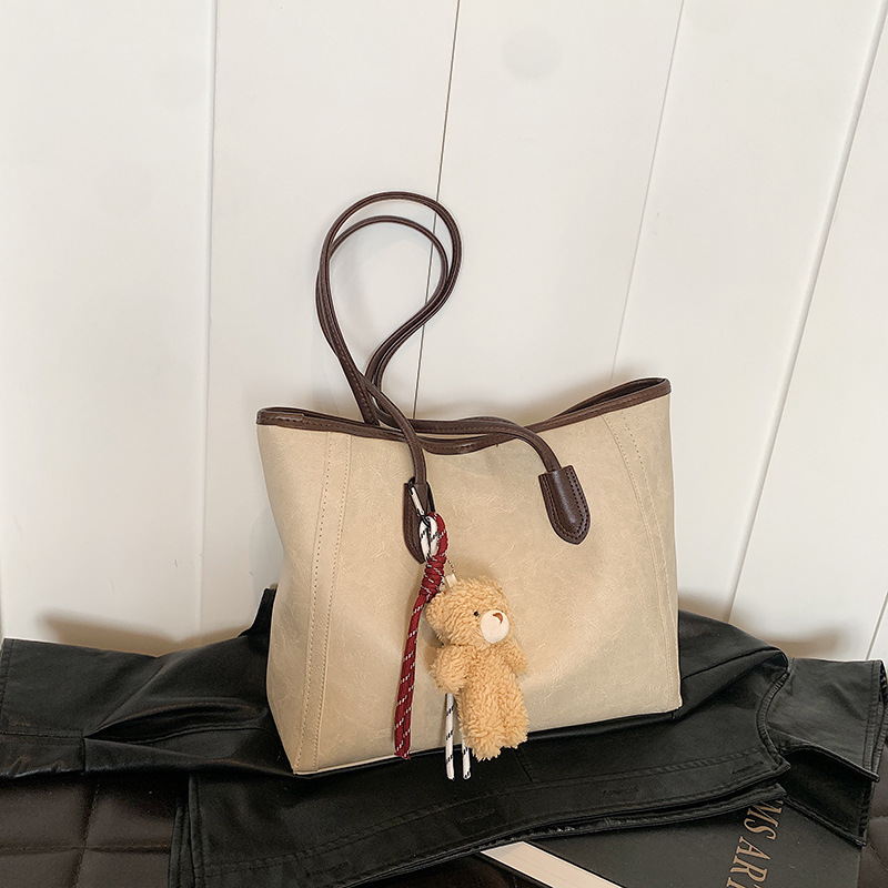 Bagos de textura de transporte aéreo 2024 otoño y invierno nuevo estilo coreano de moda bolso de hombro axilar temperamento bolso especial