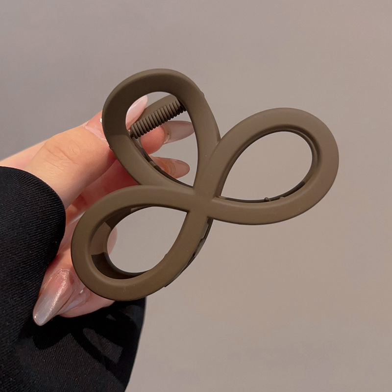 2 clip de agarre de ocho caracteres en color café