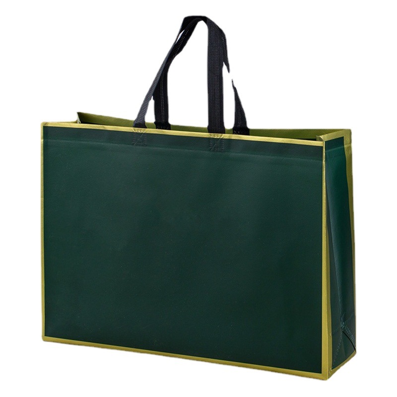 En stock bolso no tejido logotipo promocional película grande tienda de ropa bolsa de compras publicidad engrosada bolso de compras