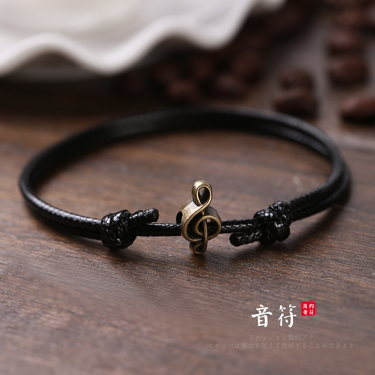 Pulsera tejida a mano – motivos trébole/póker, estilo unisex vintage