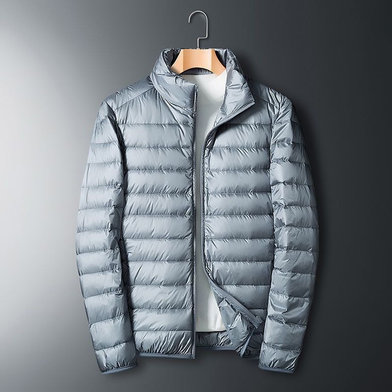 Chaqueta de algodón de terciopelo ligero para hombres de calidad Chaqueta deportiva cálida de moda de otoño e invierno de gran tamaño con cuello alto corto para hombres