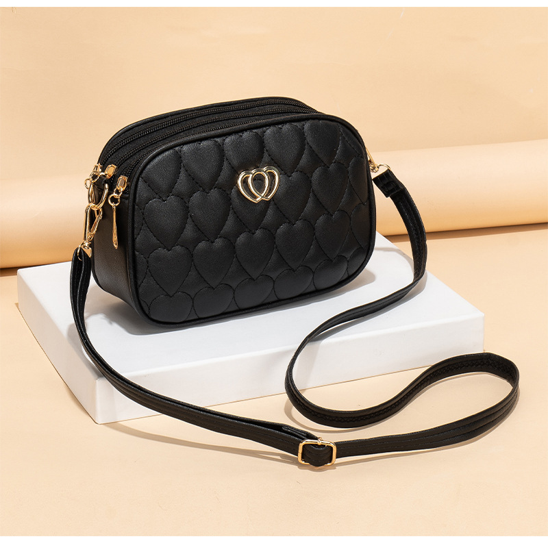 Gran capacidad de tres cremallera mochila 2024 nueva moda simple en forma de V diamante corazón bordado monocromático bolsa de cámara
