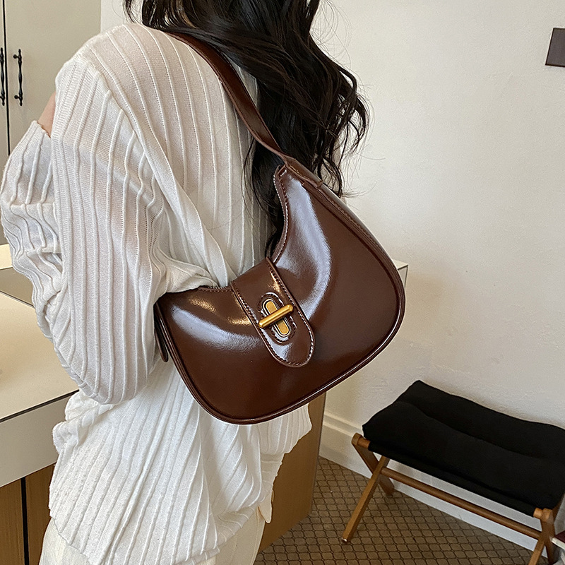 Bolso de brazo de moda de alto nivel, bolso de hombro de alta calidad, nuevo estilo de mujer 2026 simple, bolso de hombro de alta calidad, bolso de transporte universal.