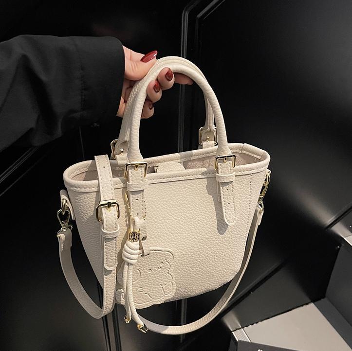 Bolsa de cubo portátil de comercio exterior 2025 nuevo bolso de mochila de textura universal nicho de diseño de red de popularidad explosiva bolso de hombro