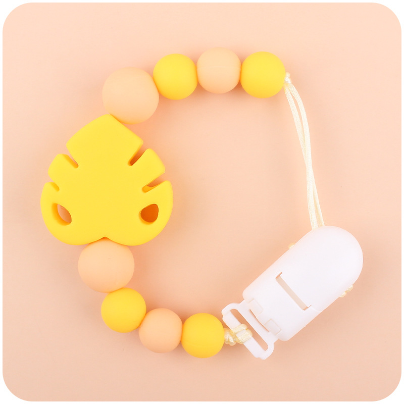 Suministros para bebés chupete cadena creativa bebé dibujos animados hojas silicona mordedura cadena anti-gota molar Nuevo