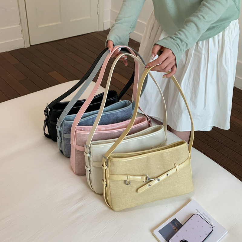 Textura transfronteriza bolso de hebilla de cuero para mujeres 2026 nueva moda diaria bolso de brazo de viaje popular bolso retro