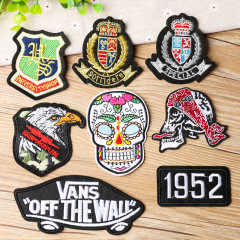 Embroidered patch with a cool, trendy design featuring a golden eagle and a skull, used as a clothing decoration patch.