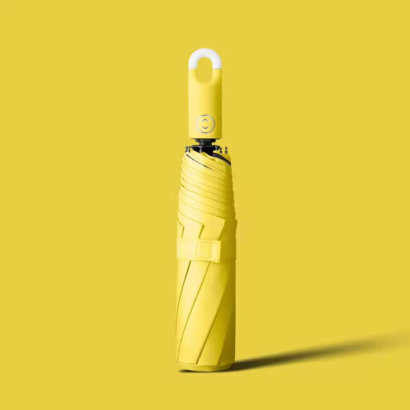 Llavero creativo paraguas pegamento negro paraguas plegable tríptico automático color sólido protección UV paraguas de sol paraguas de bloqueo