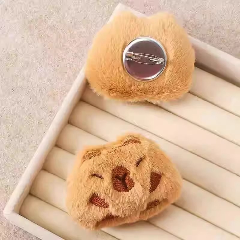 Capibara peluche pequeño colgante bolso muñeca broche muñeca adorable muñeca máquina peluche accesorios bolsas de pluma al por mayor