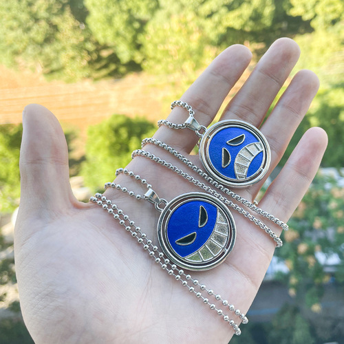 One Piece anime peripherals: Fire Fist Ace, same resin necklace with smiling face and crying face, double-sided rotating cos pendant