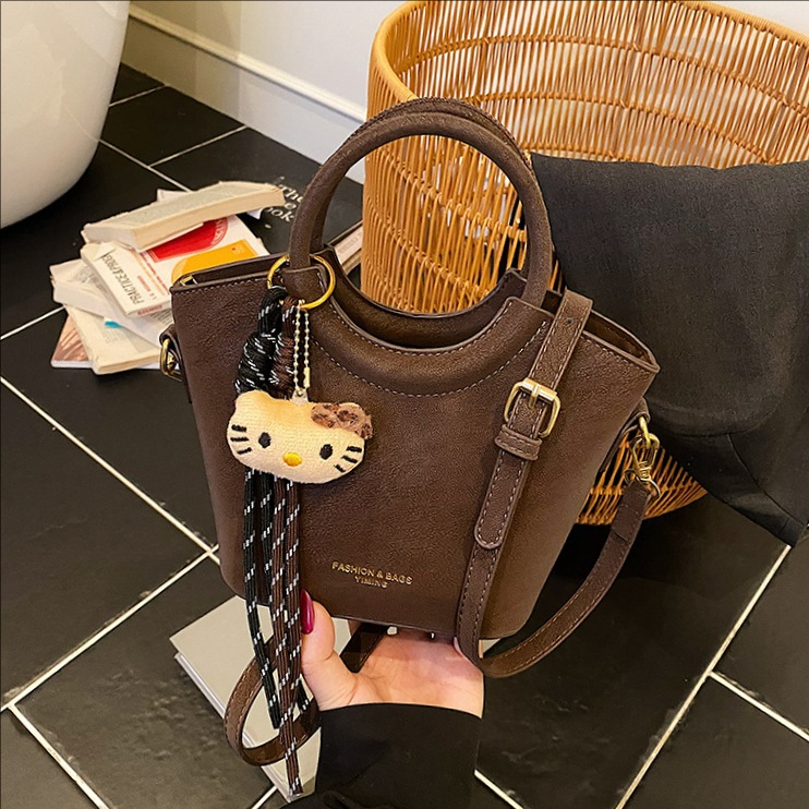 2025 otoño y invierno nuevo bolso retro mochila esmerilado bolso de hombro de moda de mujer bolso de cubo de viaje