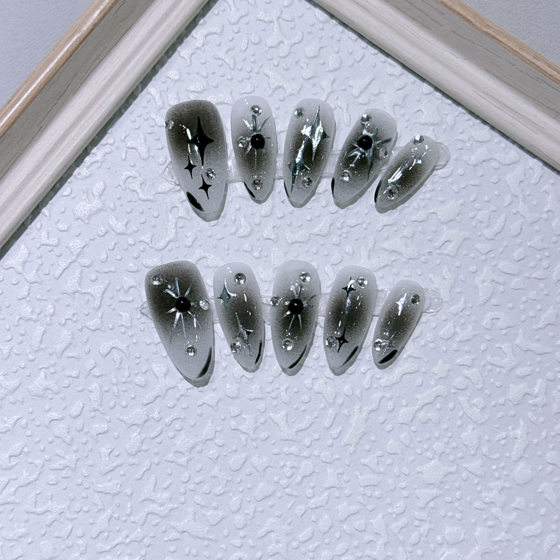 Use uñas sensación de frío plata estrellas caliente manicura chica