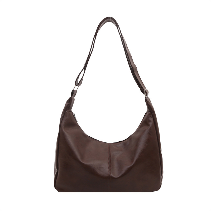 Moda de viaje de moda de gran capacidad bolsas de color sólido para mujeres 20 simple retro nuevo hombro bolsas coreanas transfronterizas