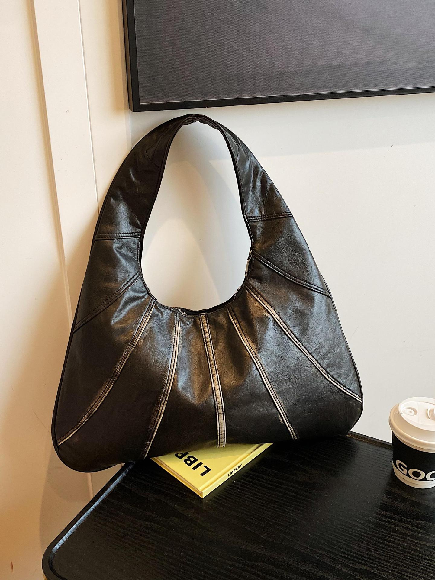 Bolsos retro para axilas para mujer 2025 nuevo bolso de hombro de nicho casual de todo fósforo bolso de viaje portátil de alta gama de moda