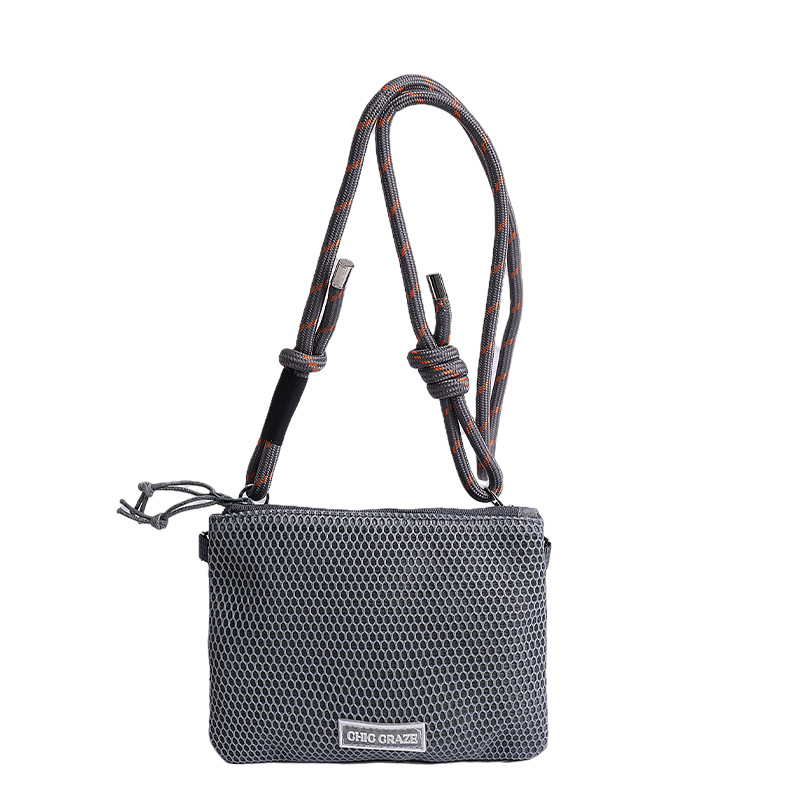 Bolsos pequeños de moda coreana 2025 verano nuevo estilo bolso femenino bolso de hombro de malla hueca bolso de mensajero de letras casuales marea
