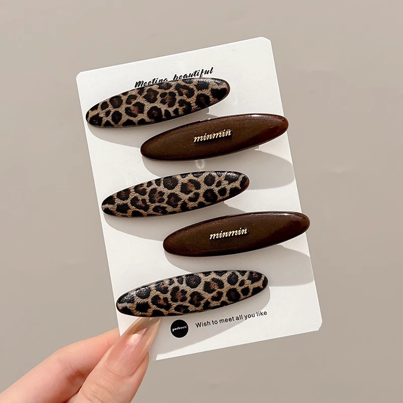 Temperamento acético cabello estriado lateral clip de cabello 2025 nuevo estilo retro puerto clip de boca de pato simple clip de cabello tocado