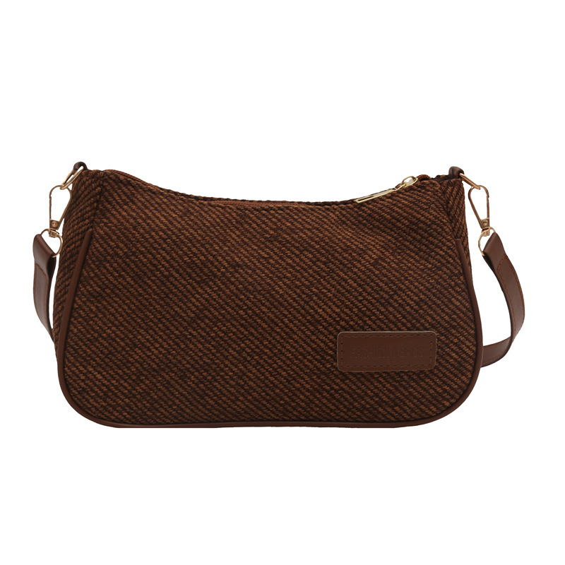 Elegante y simple temperamento nicho bolso de hombro casual 2025 primavera nuevo bolso de mochila de mujer versión coreana bolso popular