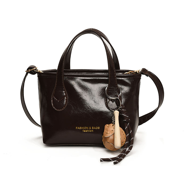 Bolso de cubo de textura de color sólido para mujer 2025 primavera nueva moda bolso de mensajero coreano estilo occidental de alta gama para mujer