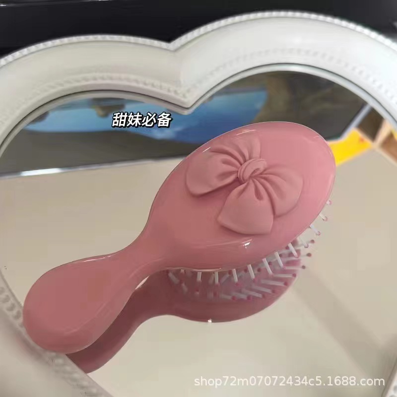 Cepillo portátil con lazo de dibujos animados, peine de masaje con cojín de aire, mini cepillo lindo para niñas